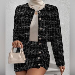 Women’s black tweed suit